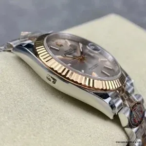 Close-up of rose gold dial with luminescent markers