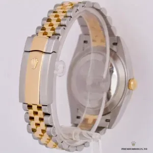 Fluted gold-plated bezel and cyclops lens detail on 126333