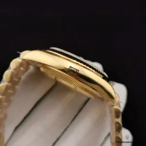 Day-Date 116610 angled shot showing fluted bezel and day window