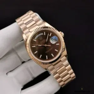 Crown side view showing rose gold plated winding crown