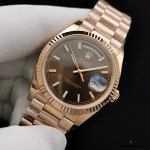 Wrist shot of chocolate dial Day-Date in outdoor lighting