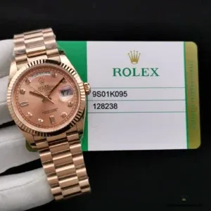 Dial macro shot displaying diamond hour markers on rose gold surface