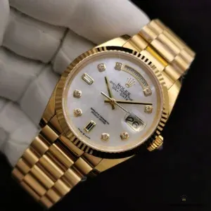 Wrist shot of MOP dial Day-Date 228239 in warm lighting