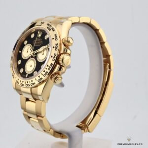 Crown and pusher side of 126508 in yellow gold plating
