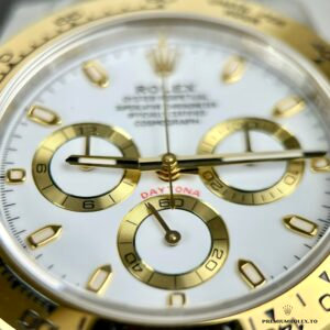 Close-up of engraved tachymeter scale on the gold-plated bezel
