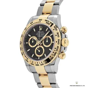 Daytona 126503 black dial at angle showing gold-toned subdials and markers