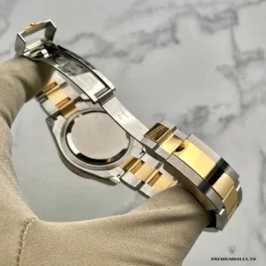 Full bracelet drape of the two-tone Daytona 126503 on flat surface