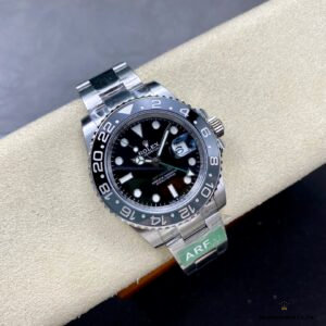 Black dial close-up with green GMT hand and lume markers