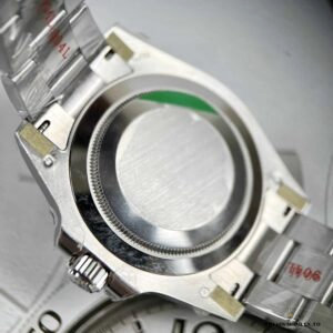 Green GMT hand and luminescent markers on meteorite dial