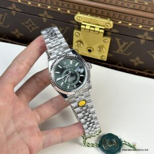 Close-up of mint green dial with off-centre 24-hour reference disc