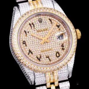 Close-up of Arabic numeral markers and diamond hour indices on dial