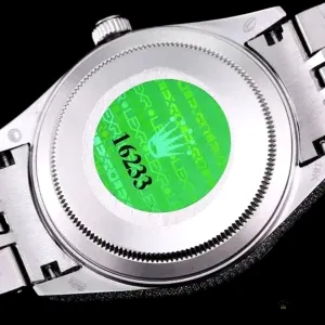 Close-up of paved diamond dial with Arabic numeral markers