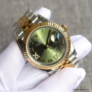 Close-up of green dial surface and brilliant-cut diamond hour indices