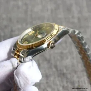Datejust 126331 wrist shot highlighting green dial under natural light