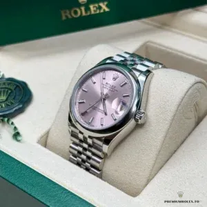 Pink dial close-up with applied stick hour markers