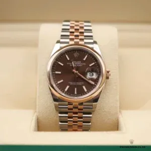Domed Everose gold-plated bezel profile and cyclops lens on 126201