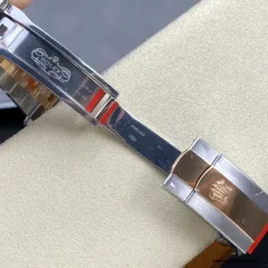 Crown side showing screw-down crown and case flank finishing