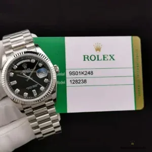 Day-Date 128238 black diamond dial angled view with fluted bezel reflections