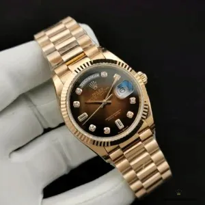 Day-Date 128238 brown ombre side profile showing gold-plated case and fluted bezel