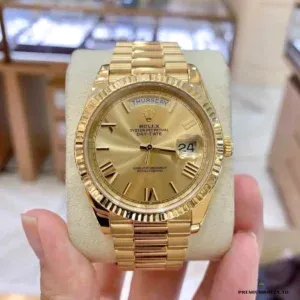 Day-Date 228238 on a watch cushion, fluted bezel and weekday window