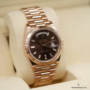 Wrist shot of Day-Date m228238 in yellow gold plating under natural light