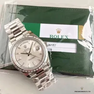 Close-up of silver gem-set dial with day display window