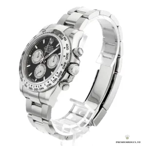 Side profile of Daytona 126509 showing white gold-plated bezel engraving