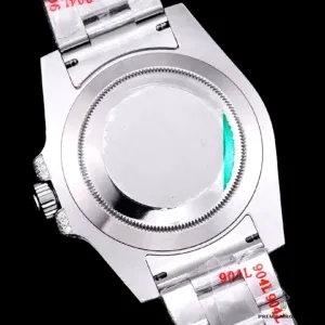 Caseback view with screw-down design and laser-etched markings
