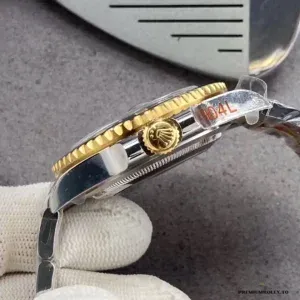 Rolex 126710BLRO two-tone crown detail showing gold-plated Triplock crown
