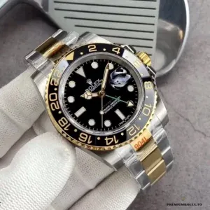 Replica 126710BLRO two-tone dial close-up with gold-tone markers and GMT hand