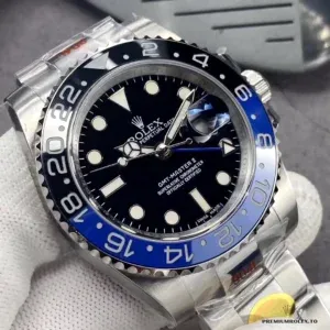 Black dial with GMT hand and luminous hour markers