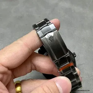 Dial macro showing tourbillon bridge and grey sunray finishing