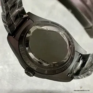 Lightning-bolt seconds hand and luminous hour markers on grey dial