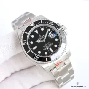 Steel Submariner 126610 held in a white glove, red 904L stickers on the case and bracelet