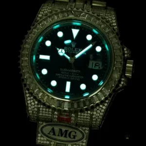 Wrist shot of 116619LB iced Submariner in natural daylight
