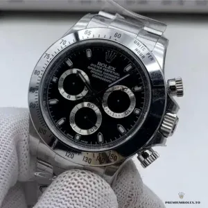 Close-up of black chronograph dial with applied luminous markers