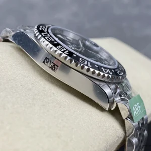 Black lacquer dial close-up with luminescent GMT hand