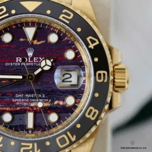 Macro of a GMT-Master II 126718GRNR tiger iron dial with black and gold-toned bezel