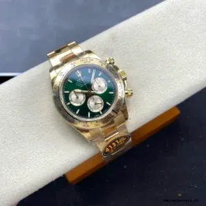 Daytona 126508 side profile showing yellow gold-plated case and green bezel