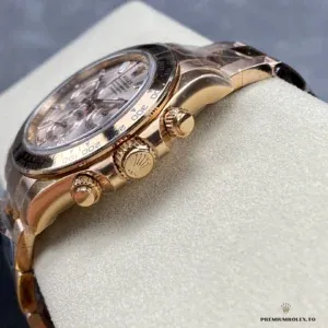 Crown and chronograph pushers on the Daytona 116505 Everose gold-plated case