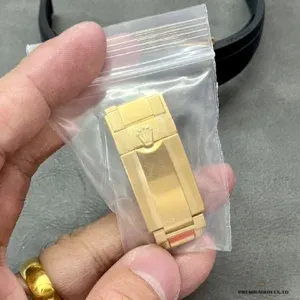 Daytona 116518LN side showing yellow gold-plated case and black Cerachrom bezel