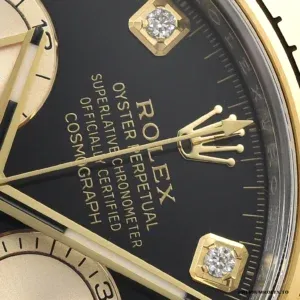 Close-up of bright black dial with diamond-set hour markers