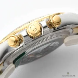 Close-up of bright black dial with gold applied hour markers