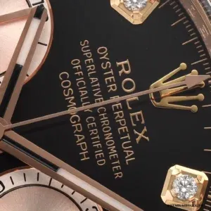 Close-up of diamond hour markers on the bright black dial