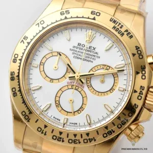 Macro of a Daytona 126508 white dial with gold-toned subdials and tachymeter bezel, gold-plated case
