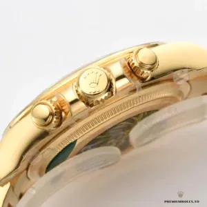 Close-up of gold dial with gem-set hour markers and subdials