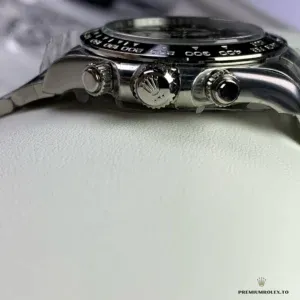 Close-up of black dial with contrasting subdials and applied markers