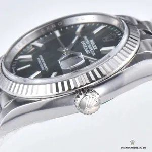 Close-up of laser-engraved palm leaf texture on the green dial