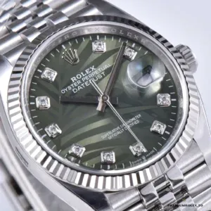 Palm-motif dial under direct sunlight showing frond definition clearly