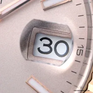 Close-up of pink sunburst dial with applied Everose gold markers